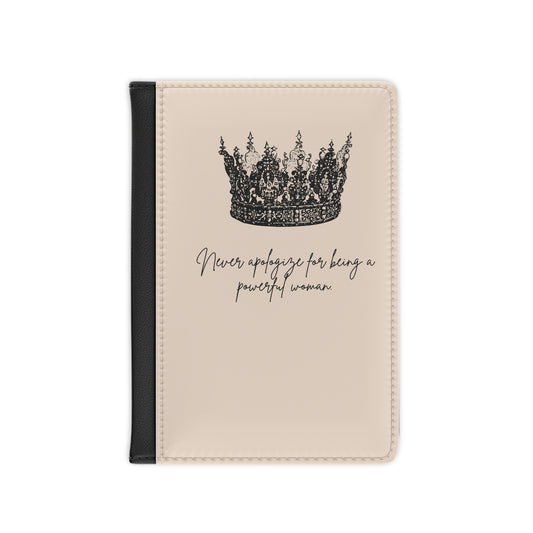 Front of Passport Cover with a cream color and detailed crown image in black. A quote is on the front cover. It says, “Never apologize for being a powerful woman